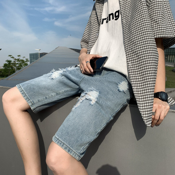 Férfi 3/4-es farmernadrág szakadt gumival és zsebekkel