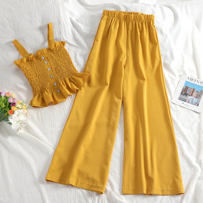 Ženski casual set s elastičnom majicom bez rukava i dugim hlačama