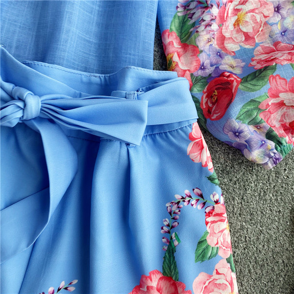 Moodne naiste komplekt, mis sisaldab lillemotiividega särki ja lühikesi pükse