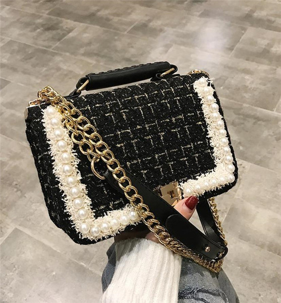 Naiste tekstiilist kott metallist sanga ja pärli kaunistusega