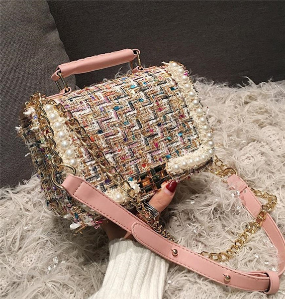 Naiste tekstiilist kott metallist sanga ja pärli kaunistusega