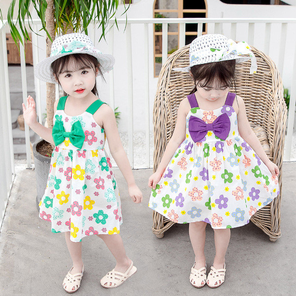 Paela ja lillemotiividega laste suvekleit