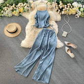 Női alkalmi szett nyakkendős felsővel és széles nadrággal