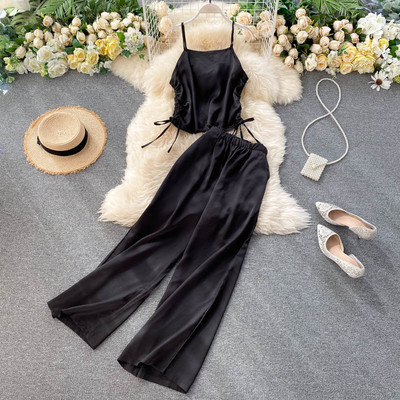 Női alkalmi szett nyakkendős felsővel és széles nadrággal