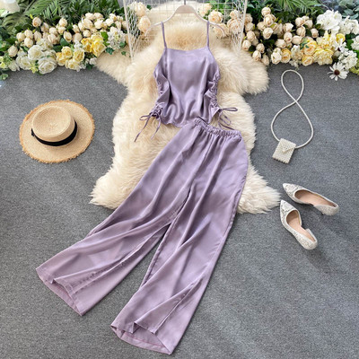 Női alkalmi szett nyakkendős felsővel és széles nadrággal