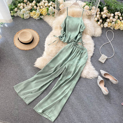 Női alkalmi szett nyakkendős felsővel és széles nadrággal