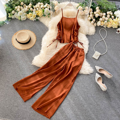 Női alkalmi szett nyakkendős felsővel és széles nadrággal