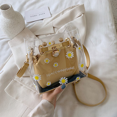 Stílusos kézitáska virágokkal és hosszú fogantyúval