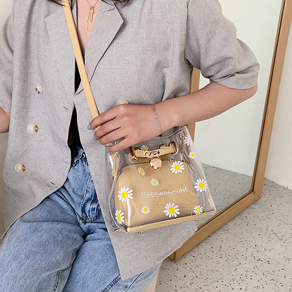 Stílusos kézitáska virágokkal és hosszú fogantyúval