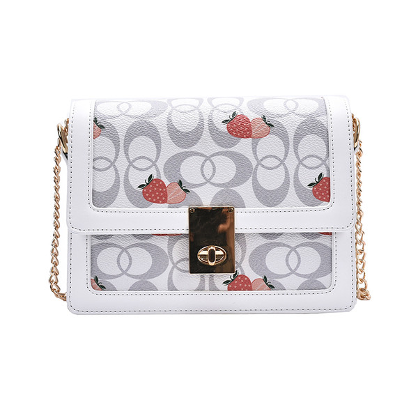 Korszerű női táska hosszú fém fogantyúval