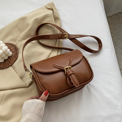 Moderna ženska torba s kopčom i dugom ručkom