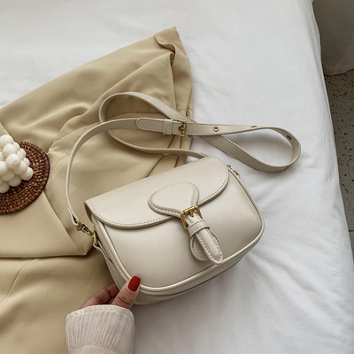 Moderna ženska torba s kopčom i dugom ručkom