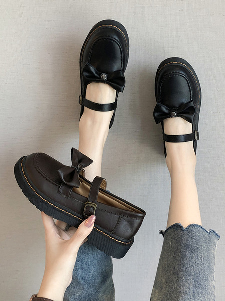 Ženske cipele s ravnim potplatom i trakom