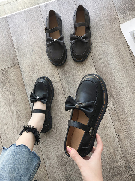 Ženske cipele s ravnim potplatom i trakom