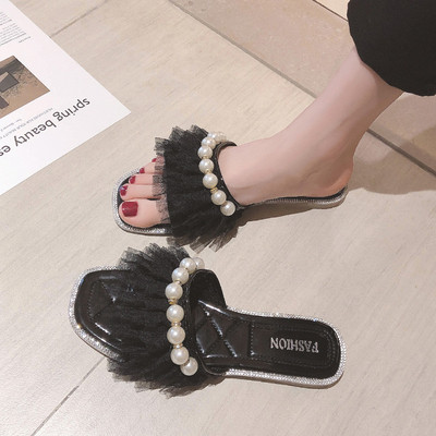 Moteriškos šlepetės plokščiu padu ir perlų elementu