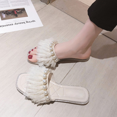 Moteriškos šlepetės plokščiu padu ir perlų elementu