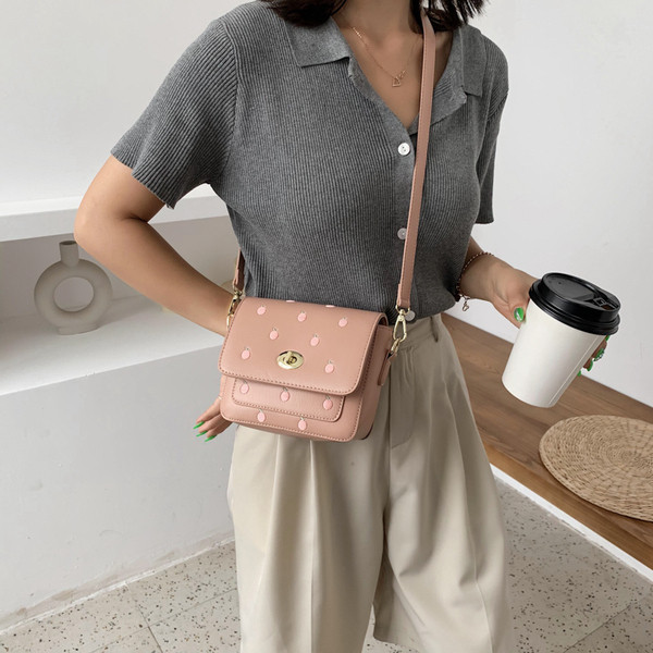 Ležerna ženska torba s vezom i dugom ručkom