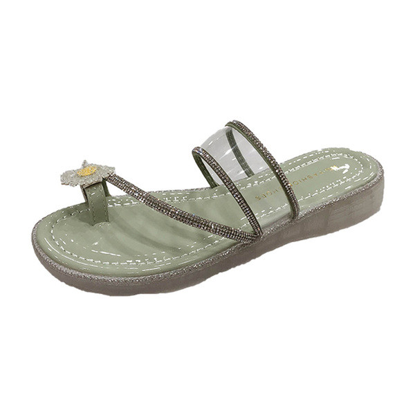 Moteriškos šlepetės plokščiu padu ir gėlių elementu