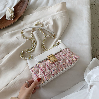 Mala ženska torbica sa šljokicama i dugom ručkom