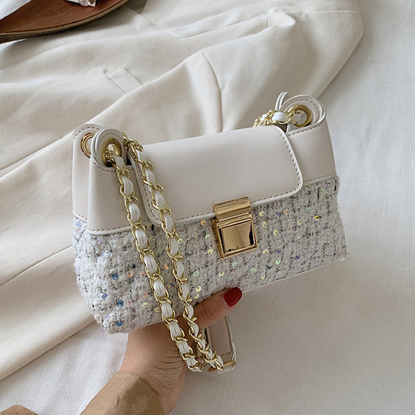 Mala ženska torbica sa šljokicama i dugom ručkom