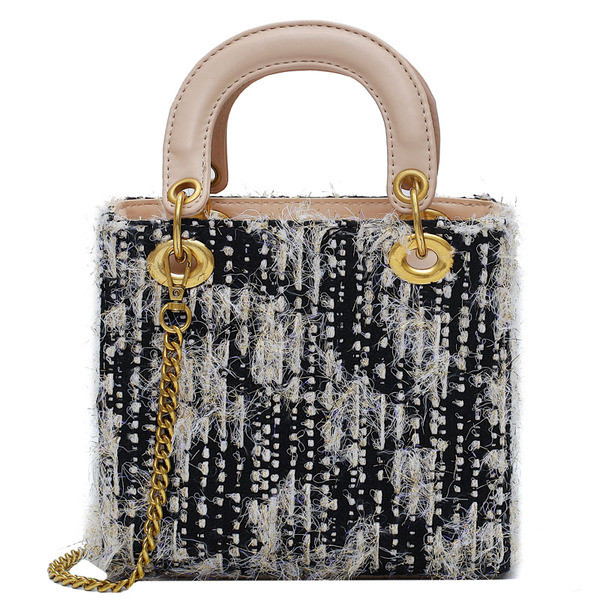 Eko bőrből készült stílusos női táska fém elemekkel