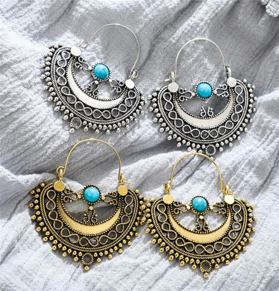 Naiste rippuvad sinise kiviga kõrvarõngad