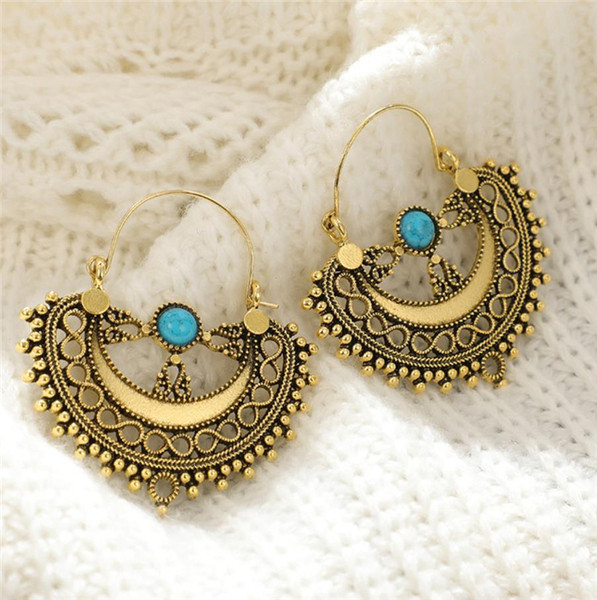 Naiste rippuvad sinise kiviga kõrvarõngad