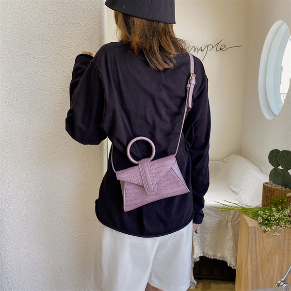 Eko bőrből készült stílusos női mini táska kerek fogantyúval