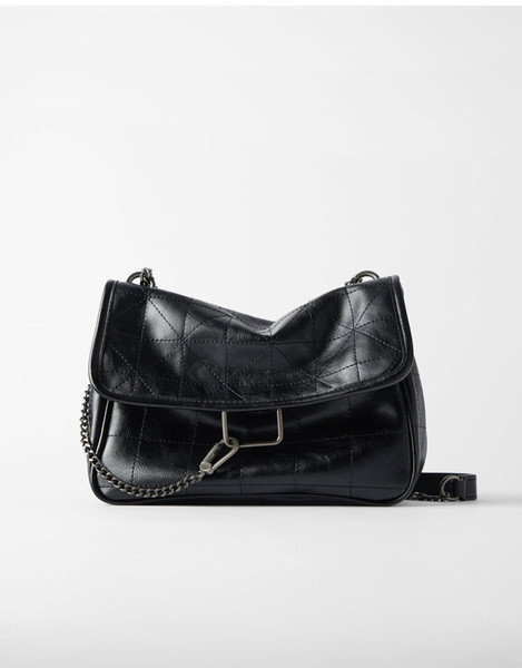 Női bőr válltáska fém fogantyúval