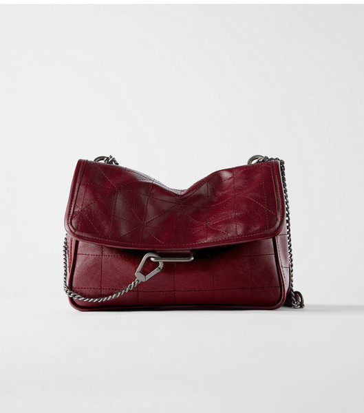 Női bőr válltáska fém fogantyúval