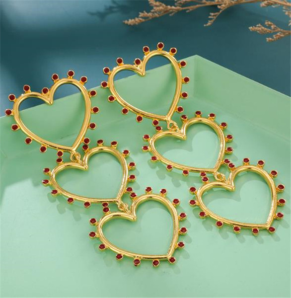 Női lógó fülbevaló arany színű szívecskékkel