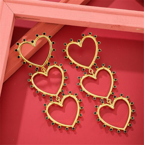 Női lógó fülbevaló arany színű szívecskékkel