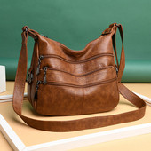 Korszerű női táska hosszú füllel és zsebekkel