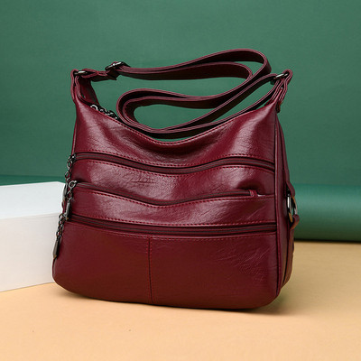 Korszerű női táska hosszú füllel és zsebekkel