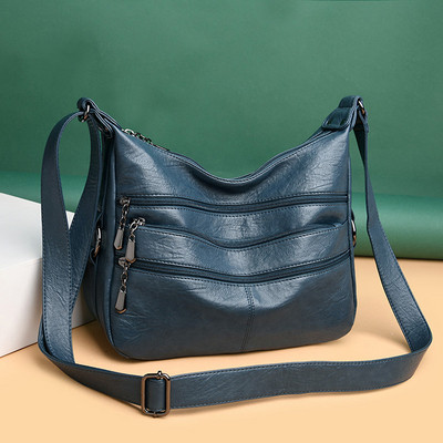 Korszerű női táska hosszú füllel és zsebekkel