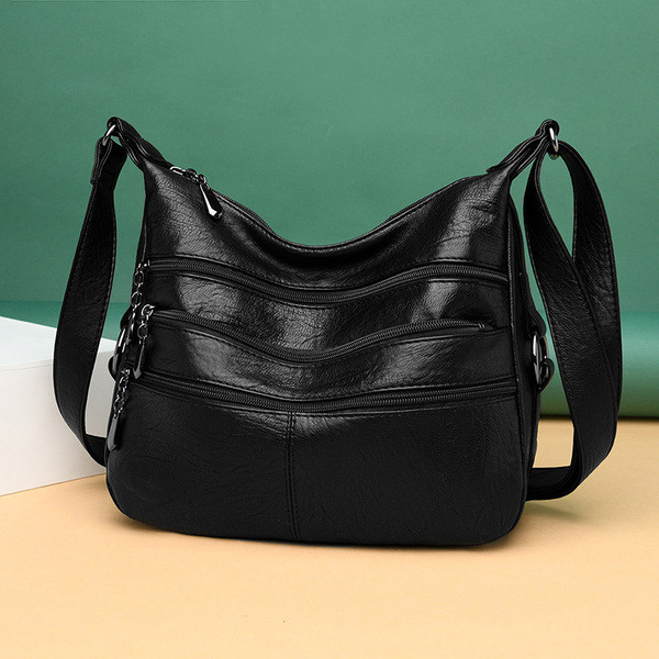 Korszerű női táska hosszú füllel és zsebekkel