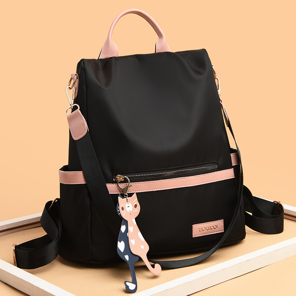 Kényelmes női hátizsák elülső zsebbel és kiegészítővel