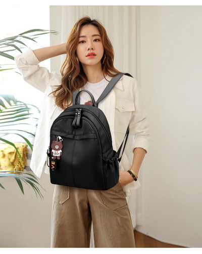 Női textil hátizsák puha fülekkel és színes kiegészítővel