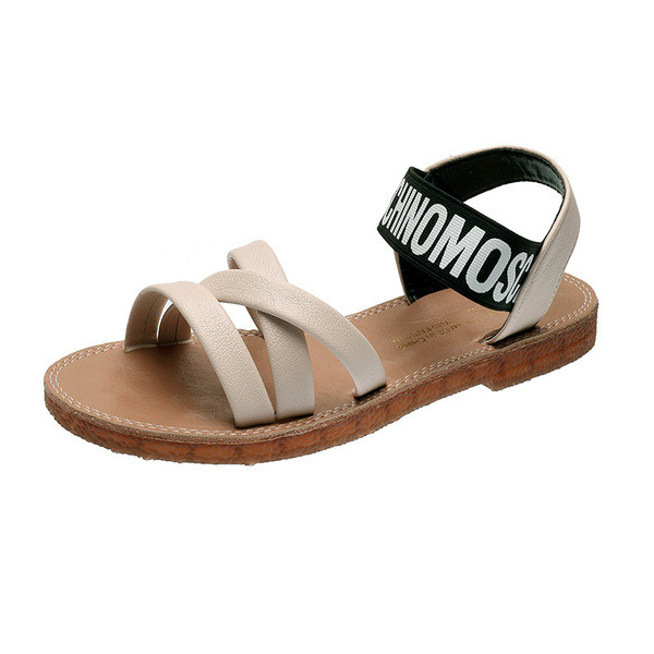 Női szandál lapos talppal és felirattal a pántokon