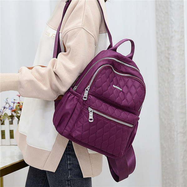 Női textil hátizsák elülső zsebbel