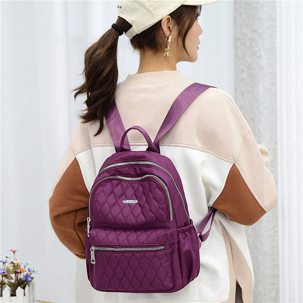 Női textil hátizsák elülső zsebbel