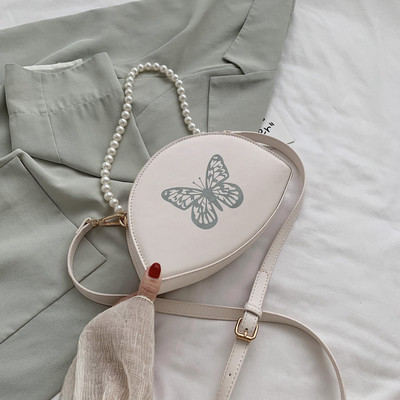 Naiste väike liblikaaplikatsiooniga kott