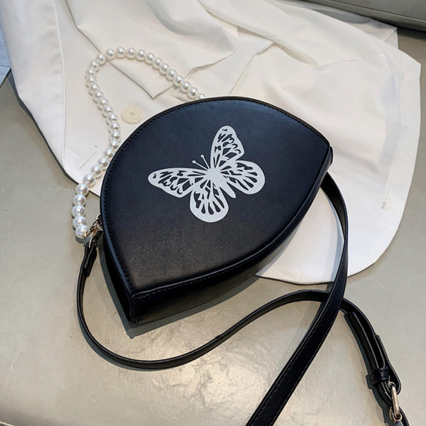 Naiste väike liblikaaplikatsiooniga kott