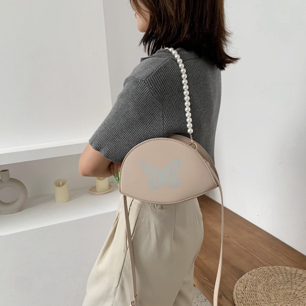 Naiste väike liblikaaplikatsiooniga kott