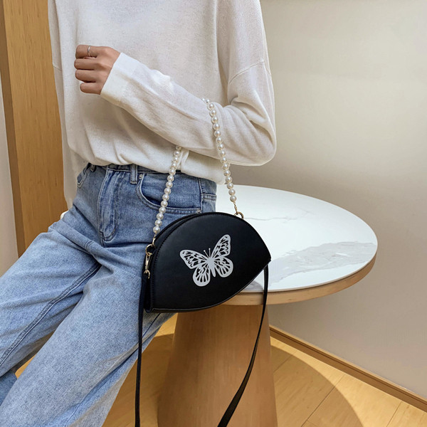 Naiste väike liblikaaplikatsiooniga kott