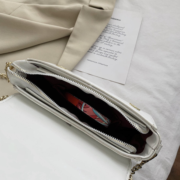 Modern női ökobőr táska fém fogantyúval