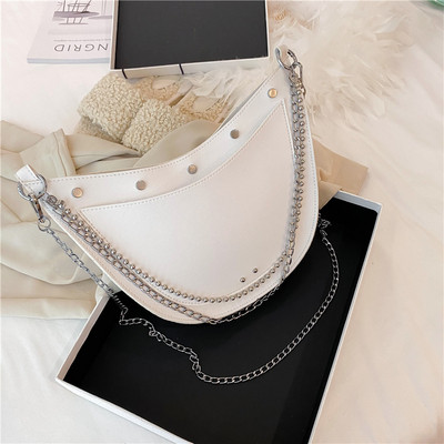 Stílusos női táska sima modell fűzőlyukakkal