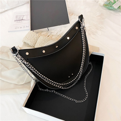 Stílusos női táska sima modell fűzőlyukakkal