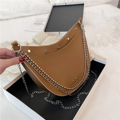 Stílusos női táska sima modell fűzőlyukakkal