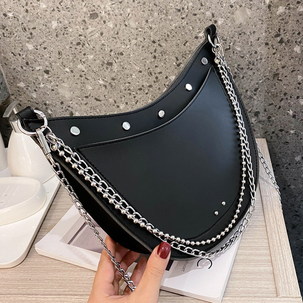 Stílusos női táska sima modell fűzőlyukakkal